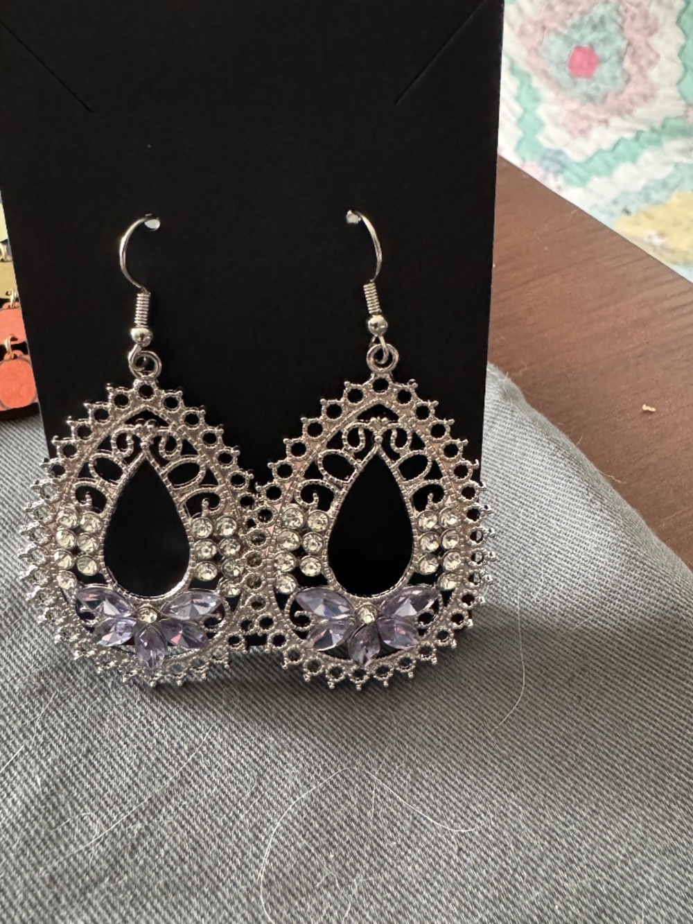 New 2.5" Silvertone Filigree Earrings with purple stones and bling on the sides: